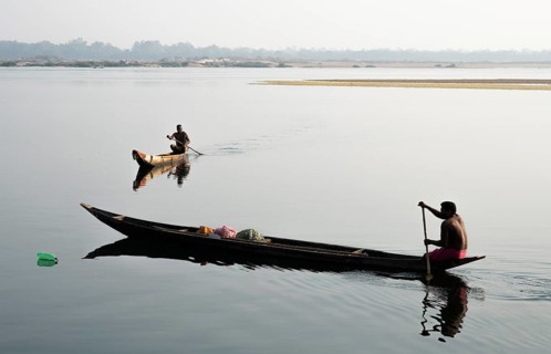 Mahanadi river, local fishermen, Sonepur, Odisha, India. The bottle on the surface of the water is