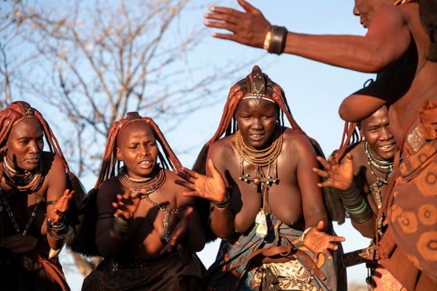 Himba woman dancing euphorically, traditional dance, traditional Himba village, Kaokoveld, Kunene,