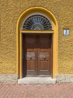 Yellow residential buildings, entrance door, borstei, heritage-protected residential development,