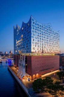 Aerial view of sunrise on the Elbe with Elbe Philharmonic Hall and reflections in the glass façade,