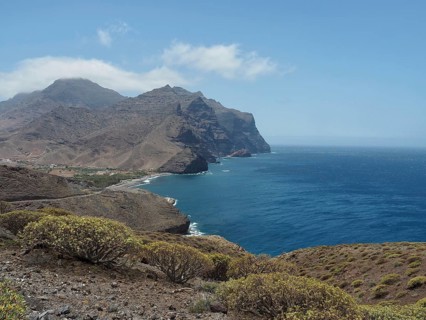 Wide coastline with rocky hills and views of the sparkling blue sea, La Aldea de San Nicolas, Gran