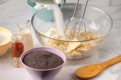 Sugar is stirred into a mixture of butter and quark