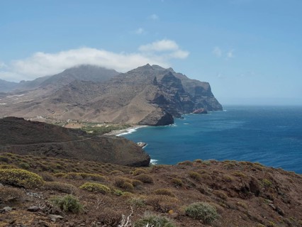 Breathtaking coastal landscape with mountains and sea under clear sky, La Aldea de San Nicolas,