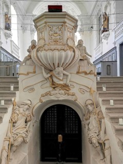 Entrance to the crypt and pulpit in the baroque castle church of St. Michael in the Castle,