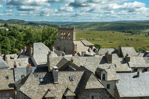 Saint Urcize. Aubrac Regional Natural Park. View of the village and the Romanesque church of