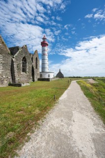 View of the 37 meter high, red-and-white striped lighthouse Phare de Saint-Mathieu, which rises