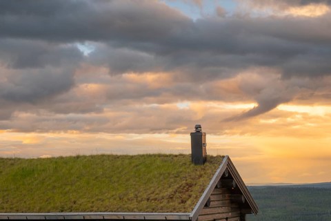 View over part of a café roof into the mountains of Gol at sunset, Hallingdal, Buskerud, Norway
