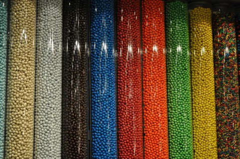 Colorful candy M&M's arranged in vertical tubes, Las Vegas, Nevada, USA