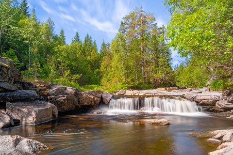 View of a waterfall and the surrounding nature, long exposure, Telemark, Norway