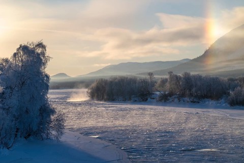 Fog and parhelion over the frozen river Glomma (Glåma), Alvdal, Hedmark, Innlandet, Norway,