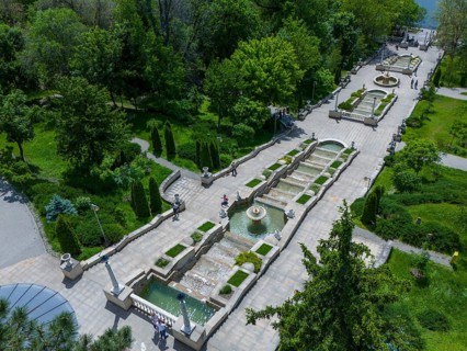Long garden path with fountain and water channel, nestled in green parkland, cascade stairs, Scara