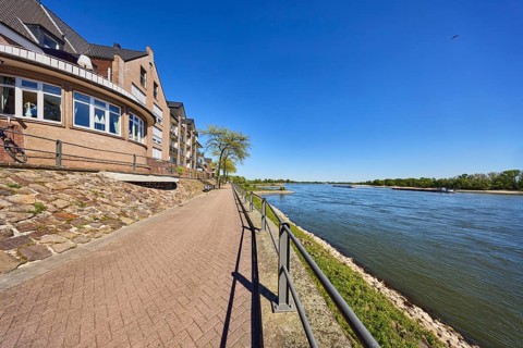 Rhine river, Rheinterrassen Rees restaurant, brick building, metal railing, waterfront, ship,