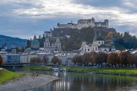 View of Salzach and old town with Hohensalzburg fortress, collegiate church and cathedral,