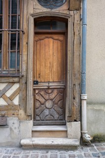 Old wooden door on a half-timbered house in the old town of Troyes, Aube department, Grand Est
