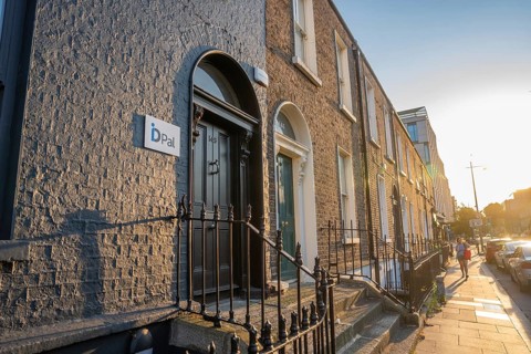 Row of townhouses in warm sunlight with historic architectural elements, Dublin, Ireland