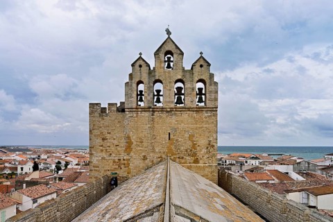 Bell tower of the Notre-Dame-de-la-Mer Roman Catholic Church, Saintes-Maries-de-la-Mer, Camargue,