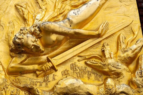 Excerpt from the gilded façade relief The Light Bringer by sculptor Bernhard Hötger, historic