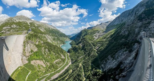 Panoramic view from air side facing away from water side of 200 meter high Kölnbrein dam with