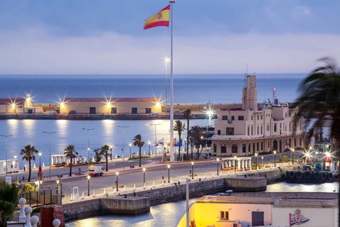 Late afternoon lights illuminate the port Authority building and surroundings, Ceuta, Spain, North