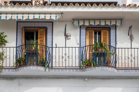 Two balconies with tile decoration, Frigiliana, Malaga Province, Andalucia, Spain