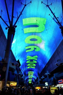 Glowing blue dome with large neon letters We Will Rock You across the street, Las Vegas, Nevada,