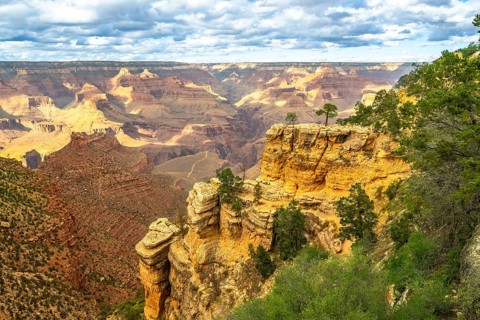 Grand canyon national park landscape displaying vast geological formations, layered cliffs, desert