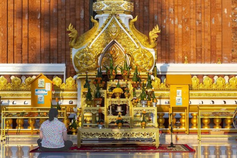 Altar for offerings to Buddha, Dharma and Sangha, in front of the chedi at Wat Phra That Phanom,