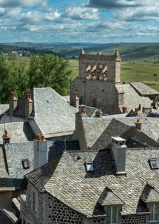 Saint Urcize. Aubrac Regional Natural Park. View of the village and the Romanesque church of