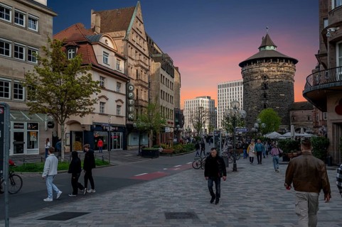 Lorenz old town with the historic Frauenturm, modern hotel buildings at the back, evening mood,