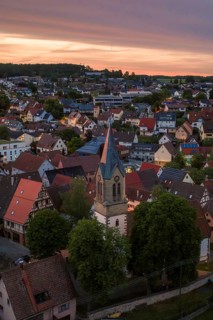 A village with church in setting sun and evening sky, Gechingen, Hecken and Gäu region, Landreis