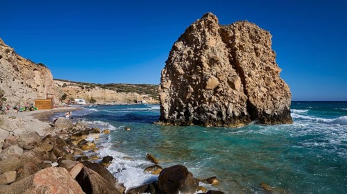 Large rock formation on a beach with turquoise sea and burning waves, Firiplaka beach, Milos