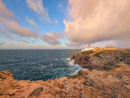 View of the Lighthouse of Cabo de Sao Vicente in Sagres, Algarve, Portugal, at sunrise with