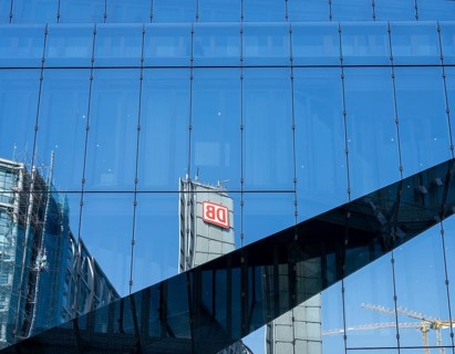 Reflective, modern glass façade of The Cube office building at Berlin Central Station,
