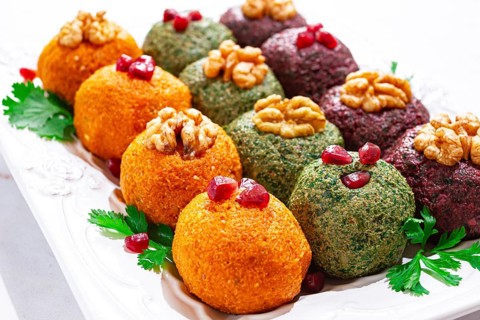 Assortment of Pkhali, pumpkin, spinach and beetroot, Georgian dish, on a white plate, appetizer
