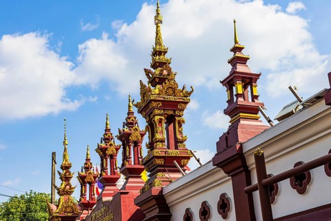 Small temple towers, chedi's, stupas, border the Buddhist temple complex Wat Phra That Doi Kham,