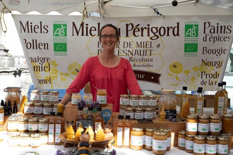 French woman, 44 years old, selling honey at the Marché de Producteurs producer market, Brantôme,