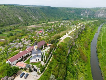 A church on top of a gorge with a river and green landscape in the area, aerial view, St. Mary's