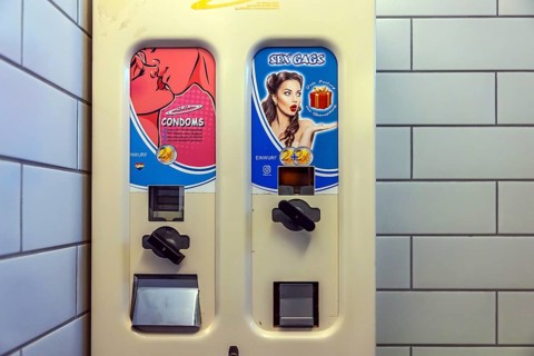 Condom machine in a men's restroom. Stuttgart, Baden-Württemberg, Germany