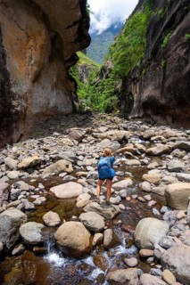 Female hiker in the Tugela Gorge or Tugela Gorge in the riverbed, Drakensberg National Park,