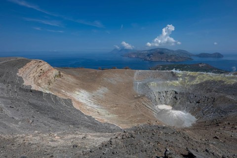 Crater, crater rim, sulfur vapors rise, in the background Panarea and Stromboli, Vulcano, Aeolian