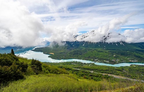 View of snowy mountains in spring and turquoise blue Kenai Lake, Slaughter Ridge Trail, Cooper