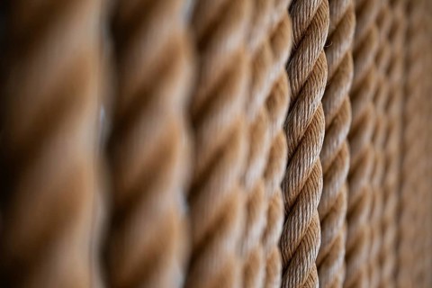 Close-up of several twisted thick ropes hanging close together, Strandingsmuseum St. George, North