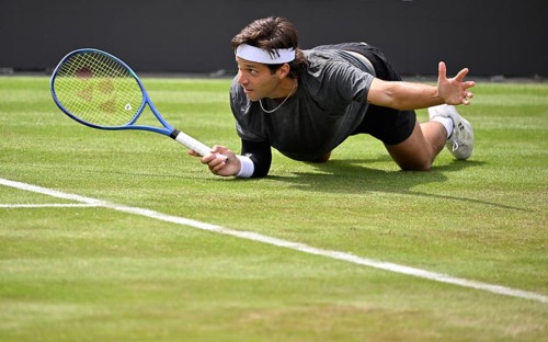 Alexis Galarneau (CAN) in action on court, gesturing, BOSS Open 2026, ATP 250 tennis, grass-court