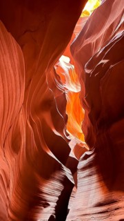 Antelope canyon featuring incredible sandstone formations with light shafts illuminating the