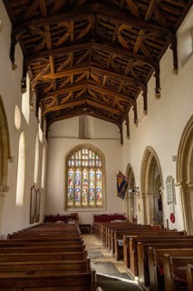 Nave, wooden ceiling, benches, windows, interior view, St Mary's Church, Bibury, The Cotswolds,