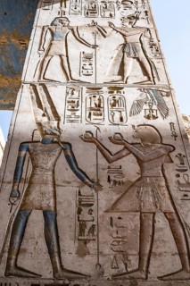 Close up details of ancient Egyptian history shown in reliefs and hieroglyphs inside Medinat Habu,