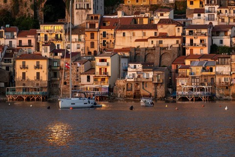 Houses by the sea, just after sunrise, Scilla, on the Strait of Messina, Calabria, Italy