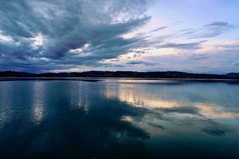 Cloud formation over Lac d'Aiguebelette, Large Natural Lake, at the foot of the Épine Mountains,