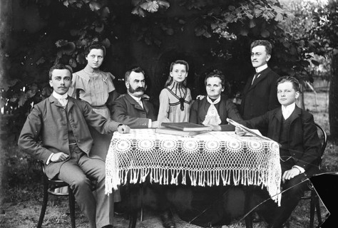 Family, at table, garden, outdoor family portrait with tablecloth and formal clothing in black and