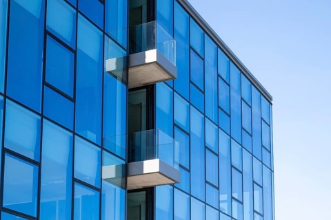 Modern commercial building on Lake Phoenix, glass façade with balconies, detail, Hörde, Dortmund,